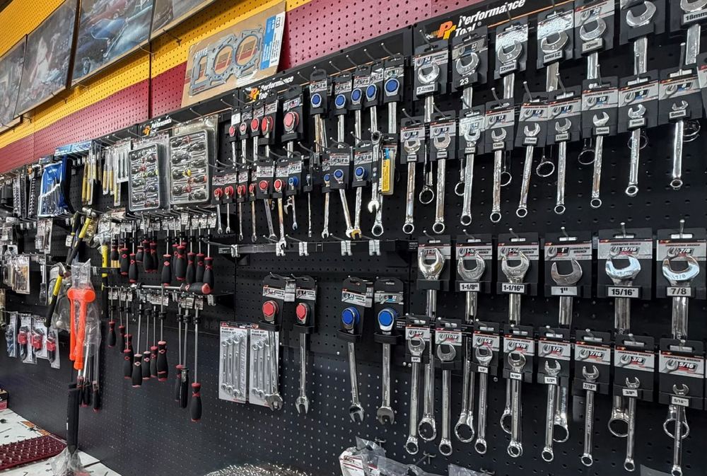 A wall of wrenches and hand tools in the shop