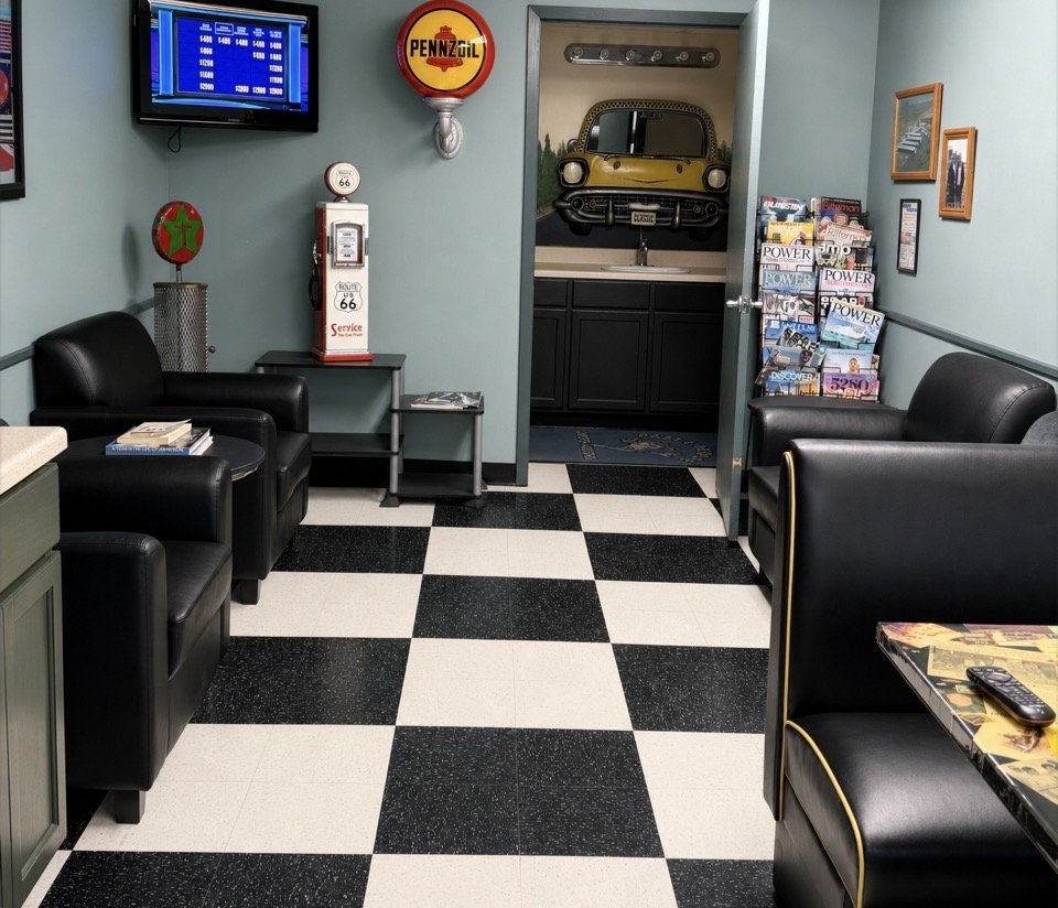 The customer waiting room with leather chairs